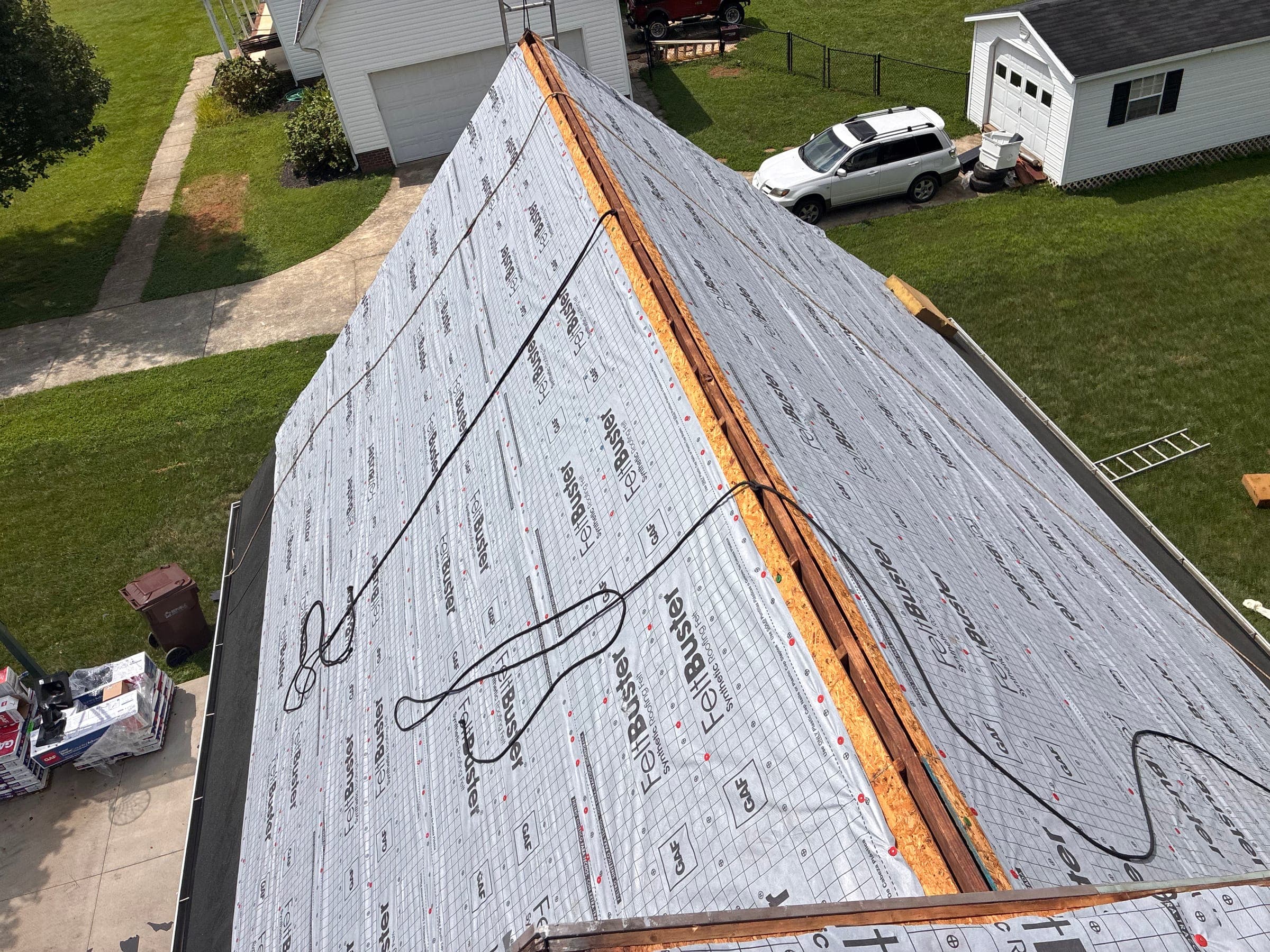 Roof ridge stripped to the deck and covered in synthetic underlayment